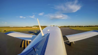 A small general aviation aircraft, its pre-takeoff checklist complete, taxis carefully to the