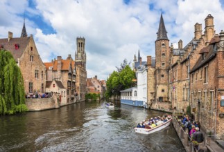 BELGIUM, BRUGES - MAY 26: boats full of tourist enjoying the dock of the Rosary on May 26, 2015