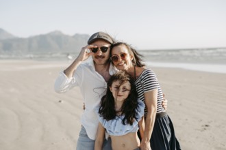 Family on the sandy beach in Sommerset West, Cape Town, South Africa, Africa