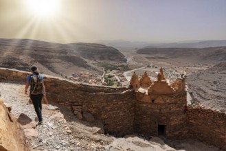 Hiking through the old Id Aissa agadir, an old granary in Amtoudi, Morocco, Africa