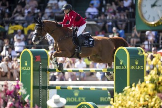 Erynn Ballard of Canada and riding De Flor 111 Z Santa Rosa compete in the first round of the 1.60m