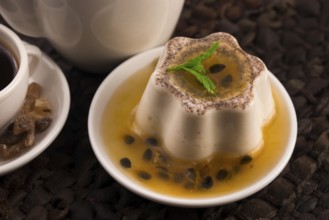 Panna cotta dessert with passion fruit and mint