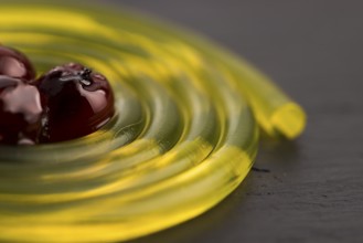 Molecular fruit spaghetti with rowan in syrup
