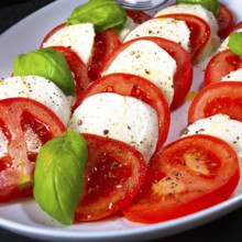 Tomatoes with mozzarella and basil