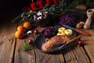 Roast goose with baked apples, red cabbage and dumplings