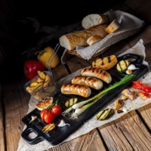 Delicious grilled sausage with various grilled vegetables