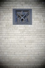 Cologne, Germany - November 24, 2016: The coat of arms of St. Kunibert Basilica embedded in the