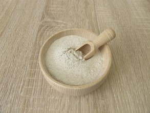 Banana flour made from green plantains in a wooden bowl