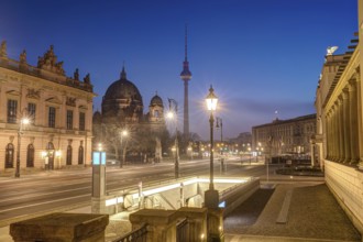 The famous boulevard Unter den Linden in Berlin with the television tower at dusk