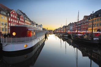 Ships in Nyhavn at sunset, Copenhagen, Denmark, Europe