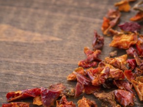 Cayenne pepper or paprika on wooden backround with copy space. Dry red pepper with copyspace