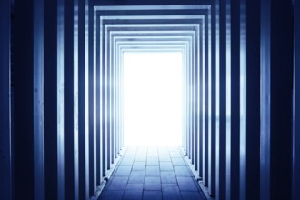 Line-shaped corridors leading to unknown bright exit door