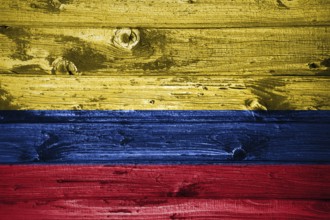 Colombia flag on wooden planks background wood flag