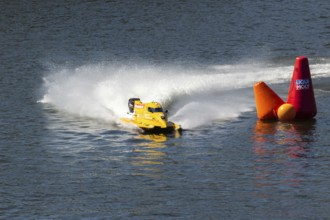 PESO DA REGUA, PORTUGAL - SEPTEMBER 15, 2024: Yellow Powerboat Makes Sharp Turn with Splashes of