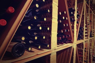 Wine Cellar from Mediterranean with bottles stacked in rows