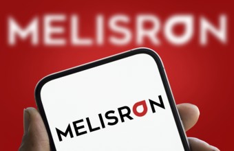 Melisron logo is displayed on smartphone. Melisron Ltd is an Israel based investment company