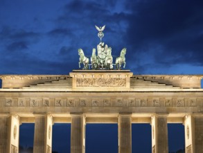 Symmetrical night shot of the Brandenburg Tor, majestically illuminated, Berlin, Germany, Europe