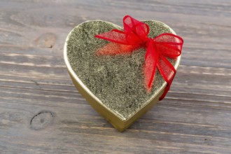 A box for a gift in the shape of a heart. Symbolic photo for Valentine's Day, wedding anniversary,