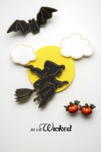 Creative Halloween concept photo of a witch made of paper on a white background