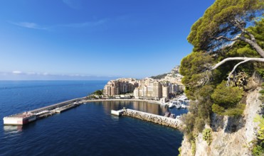 Montecarlo, Monaco, August 2022: panoramic view of the Fontvielle port with blue sky and sea,