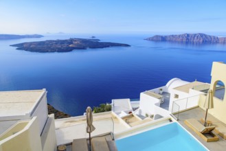 White buildings and hotels with panoramic view of Aegean Sea in Fira, Santorini, Greece, Europe