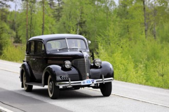 Classic 1930s Chevrolet car on Ascension Day vintage car rally by AHS ry, road 104, Fiskars,