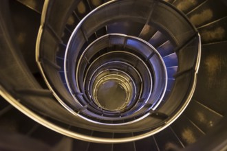 Spiral staircase in an old tower. Dark and gloomy