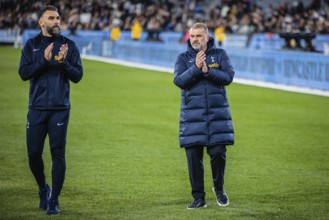 MELBOURNE, AUSTRALIA, MAY 22: Mile Jedinak and Ange Postecoglou of Tottenham Hotspur after losing