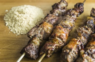Juicy meat barbecue skewer (Churrasquinho, espetinho) in close up