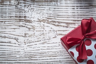 Packed present box on vintage wooden board celebrations concept