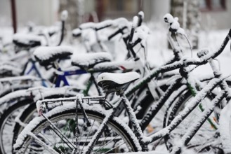 Bikes covered with a blanket of snow, winter in Finland