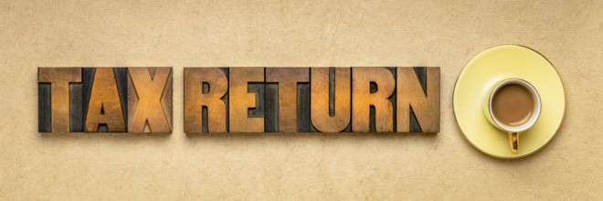 Tax return banner - word abstract in vintage letterpress printing blocks against textured paper