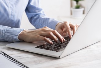 Office manager working with laptop. Corporate office workplace with computer. Business occupation