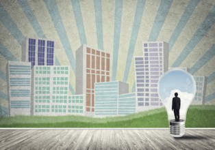 Businessman inside light bulb against city drawn concept