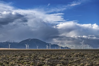 Wind turbines and wild thunder and rain clouds over the Great Basin Highway US 93, between Ely and