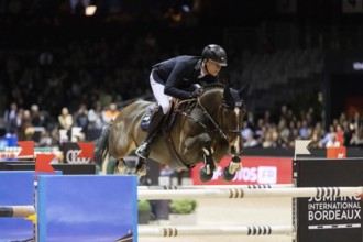 Max Kuhner of Austria competes in the Audi Grand Prix equestrian event at Jumping International