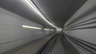 View on subway rails in tunnel from train