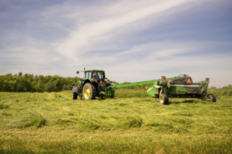 Big American tractor working on a farm with specialised equipement, New York State, USA, North