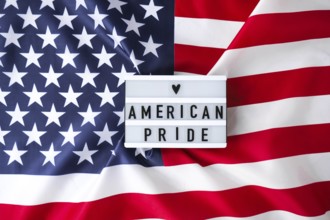 American flag. Lightbox with text AMERICAN PRIDE Flag of the united states of America. July 4th
