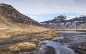 Typical Icelandic mountain landscape in Southeast Iceland with river flowing through mountains
