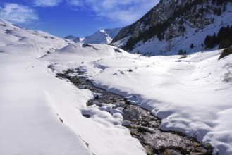 Cerler snow stream in Pyrenees of Huesca in Spain