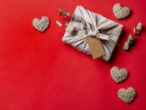 Zero waste, Valentine's Day eco-friendly gift wrapping in Furoshiki style with dry eucalypt and