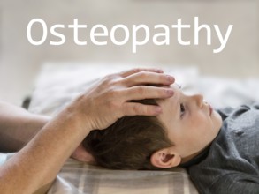 Osteopathy Treatment and word Osteopathy. Elementary age boy's forehead being manipulated by real