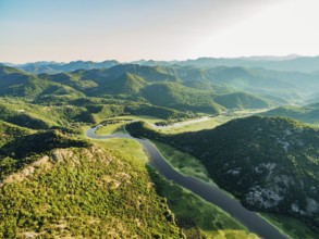 Crnojevica river canyon among green mountains. Aerial view.