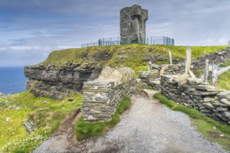 Old Moher Tower on Hags Head, watchtower at the southern end of Cliffs of Moher, popular tourist