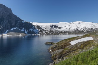 The famous road in Norway also called road 51 or the bygdin vegen near Bismo with blue water in the