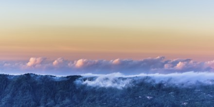 Amazing panorama view on clouds above mountain from summit of Batur volcano, Bali, Indonesia, Asia