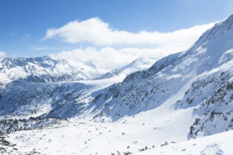 Tops of Pirin mountains view from top of cable car, ski resort Bansko, Bulgaria.