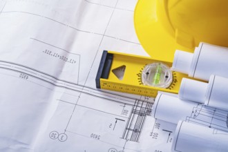 Copyspace image rolled blueprints level helmet