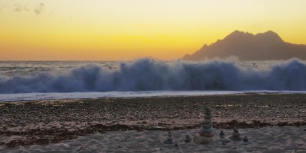 Surf wave at sunset on the beach in Porto, Corsica